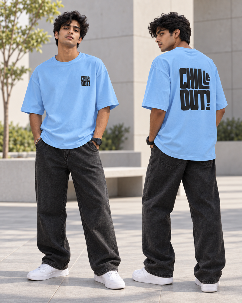 A man modeling a light blue t-shirt in an outdoor urban setting, showing both front and back views. The front features a small black graphic on the left chest, and the back features a large black graphic reading 'CHILL OUT!'.